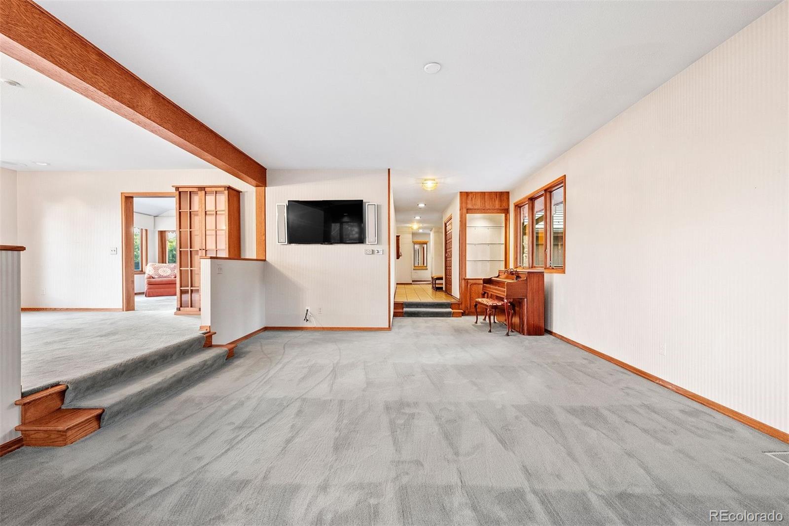 2851 Interlocken Drive Evergreen, CO 80439 - Photo 21 of 50 a view of a livingroom with furniture and a flat screen tv