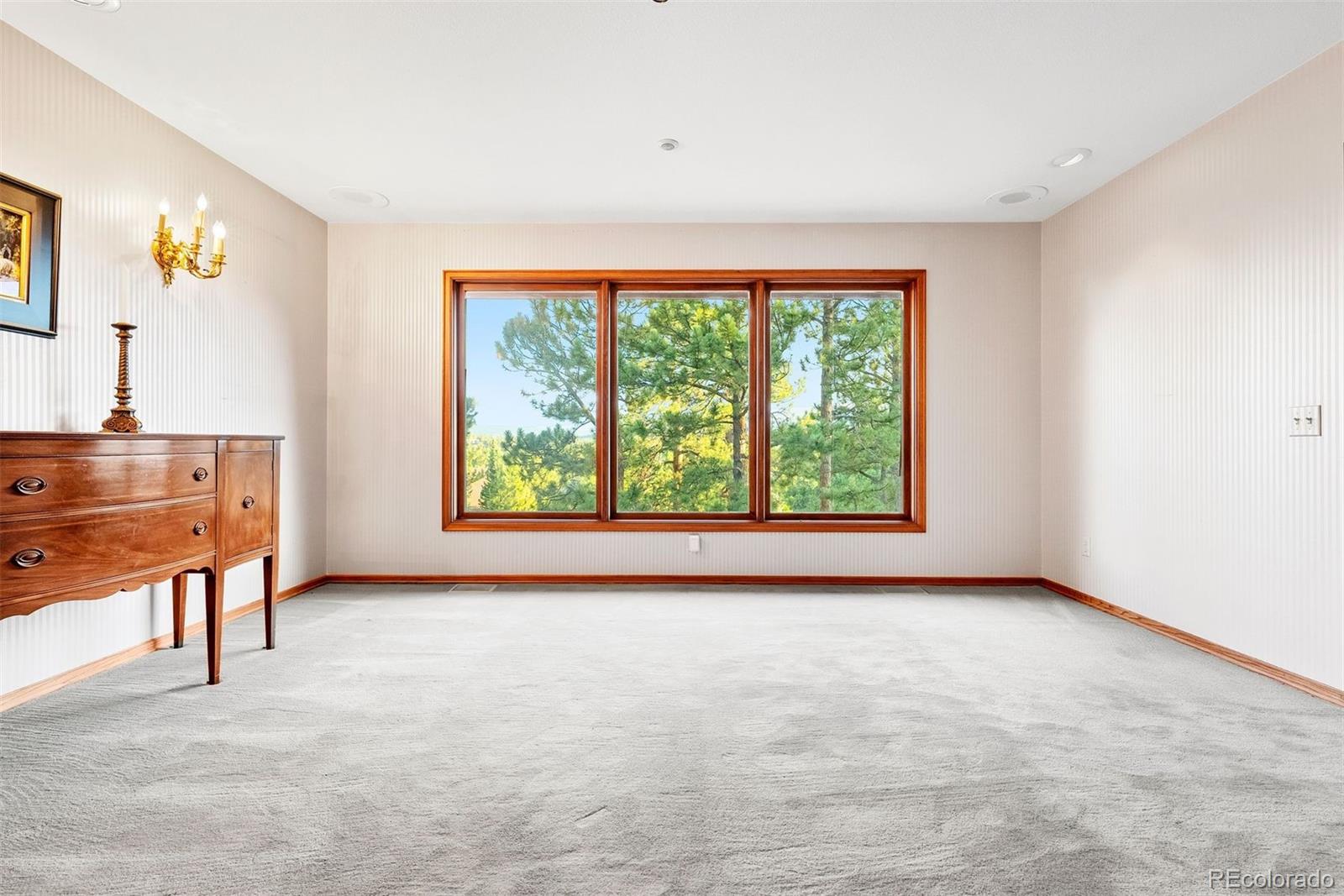2851 Interlocken Drive Evergreen, CO 80439 - Photo 24 of 50 a view of room with window and furniture