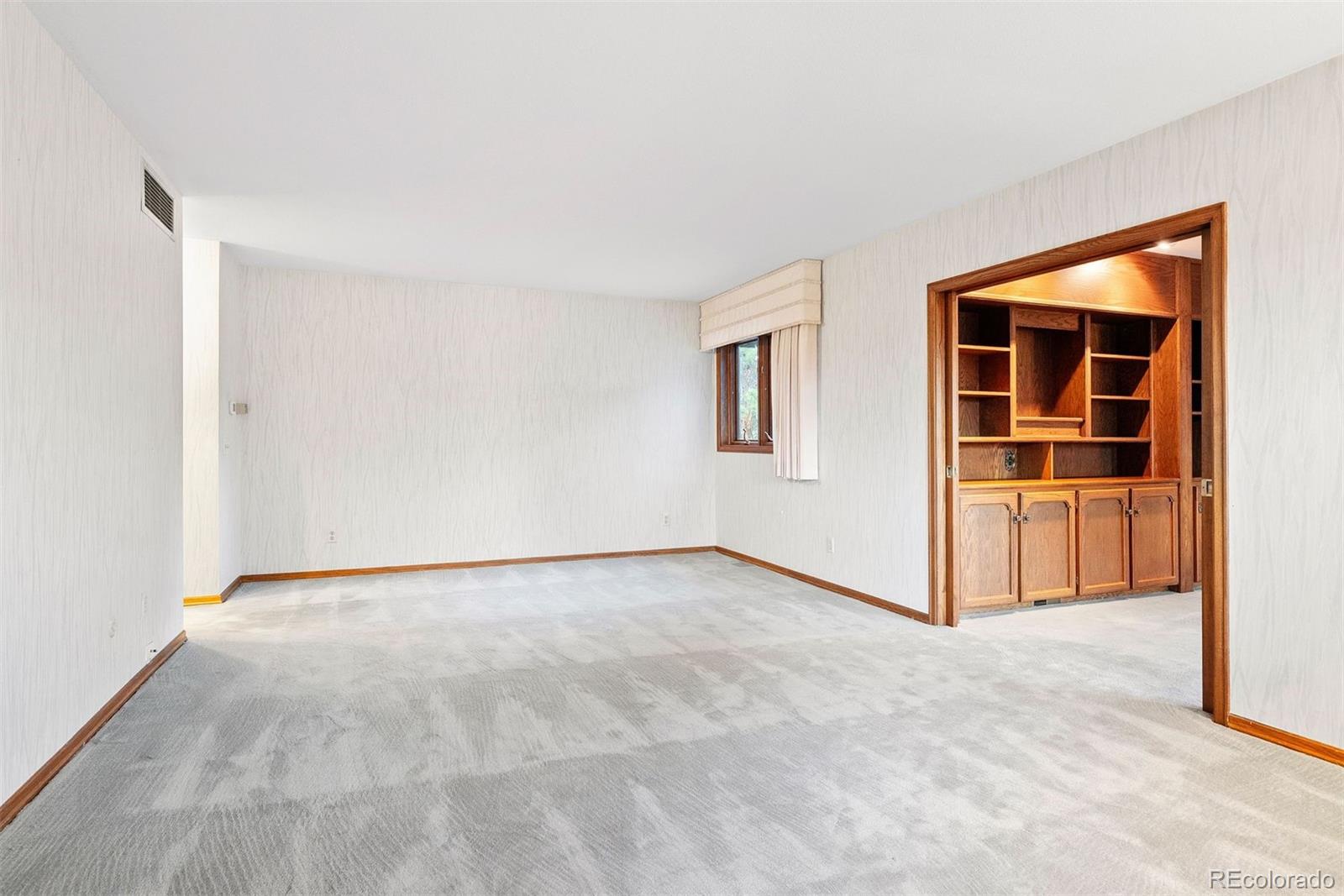 2851 Interlocken Drive Evergreen, CO 80439 - Photo 27 of 50 a view of an empty room with a window