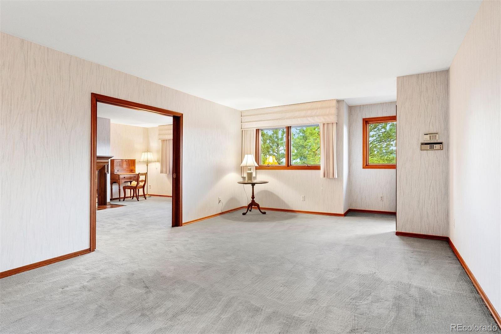2851 Interlocken Drive Evergreen, CO 80439 - Photo 29 of 50 an empty room with windows