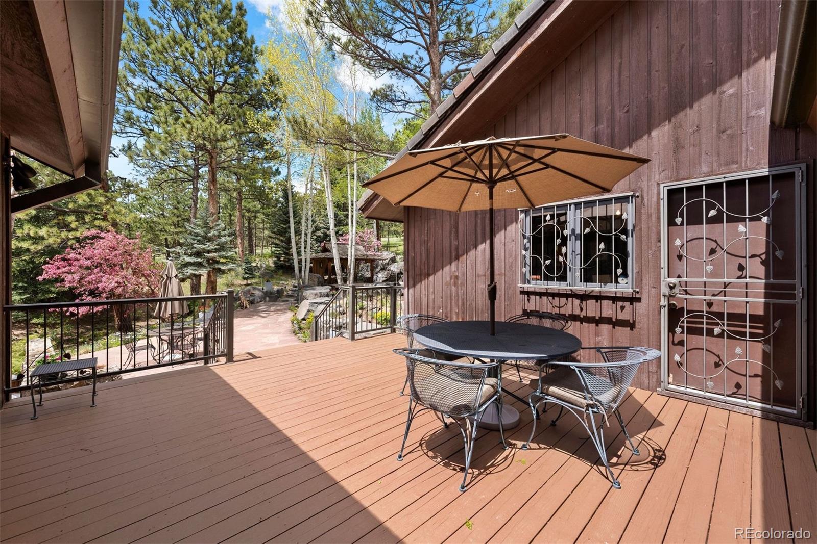 2851 Interlocken Drive Evergreen, CO 80439 - Photo 3 of 50 a patio with glass top table and chairs