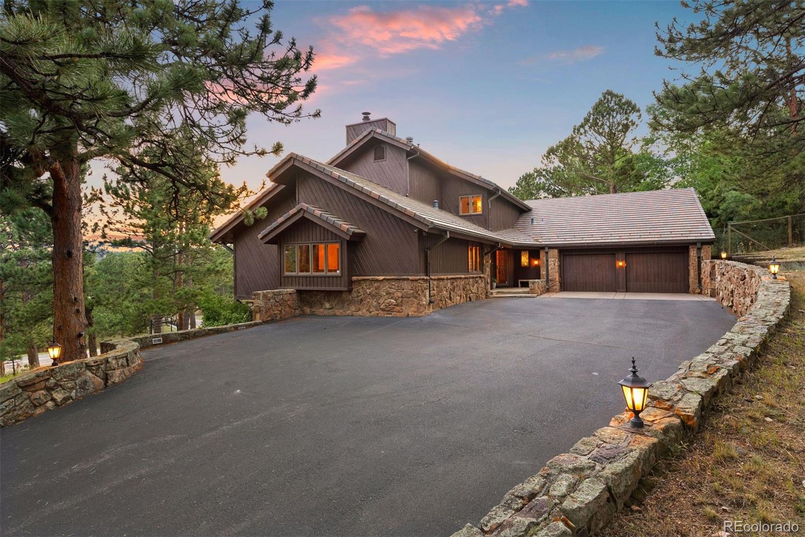 2851 Interlocken Drive Evergreen, CO 80439 - Photo 50 of 50 front view of a house with a street