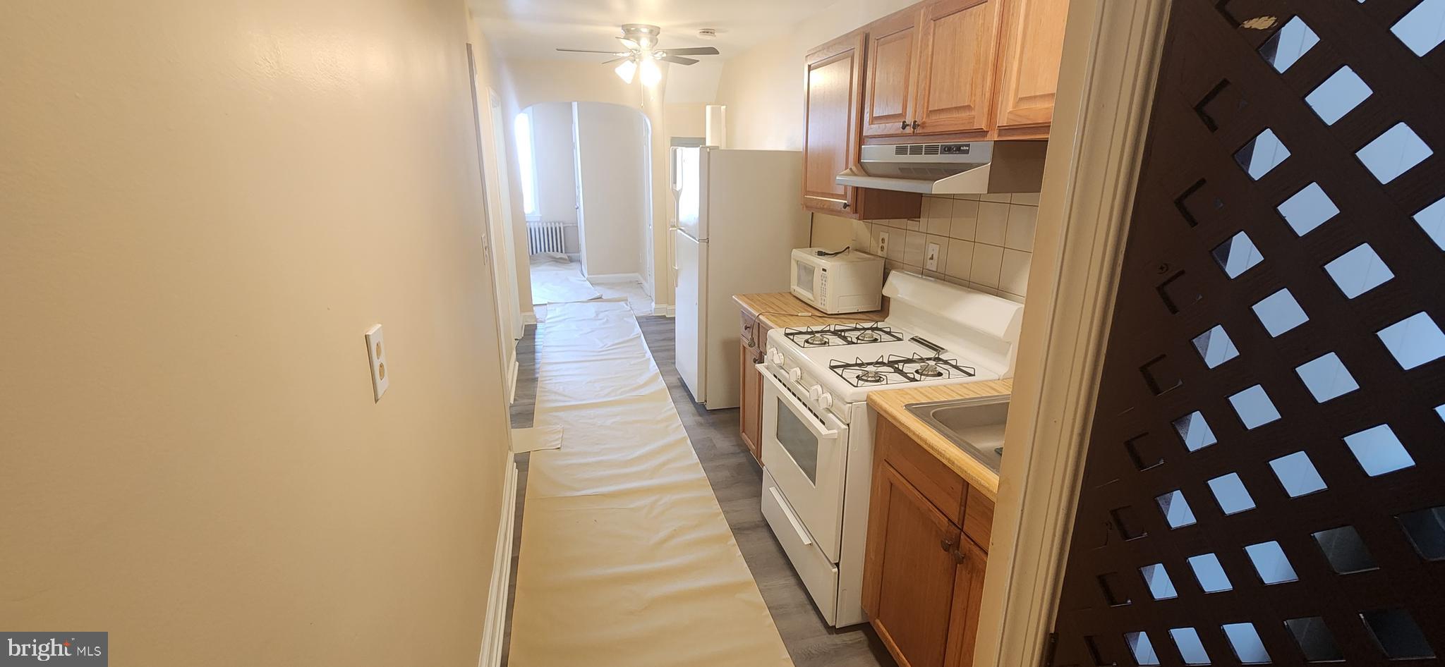 2017 I Street Northeast, Unit 4 Washington, DC 20002 - Photo 12 of 27 a kitchen with a sink and a refrigerator