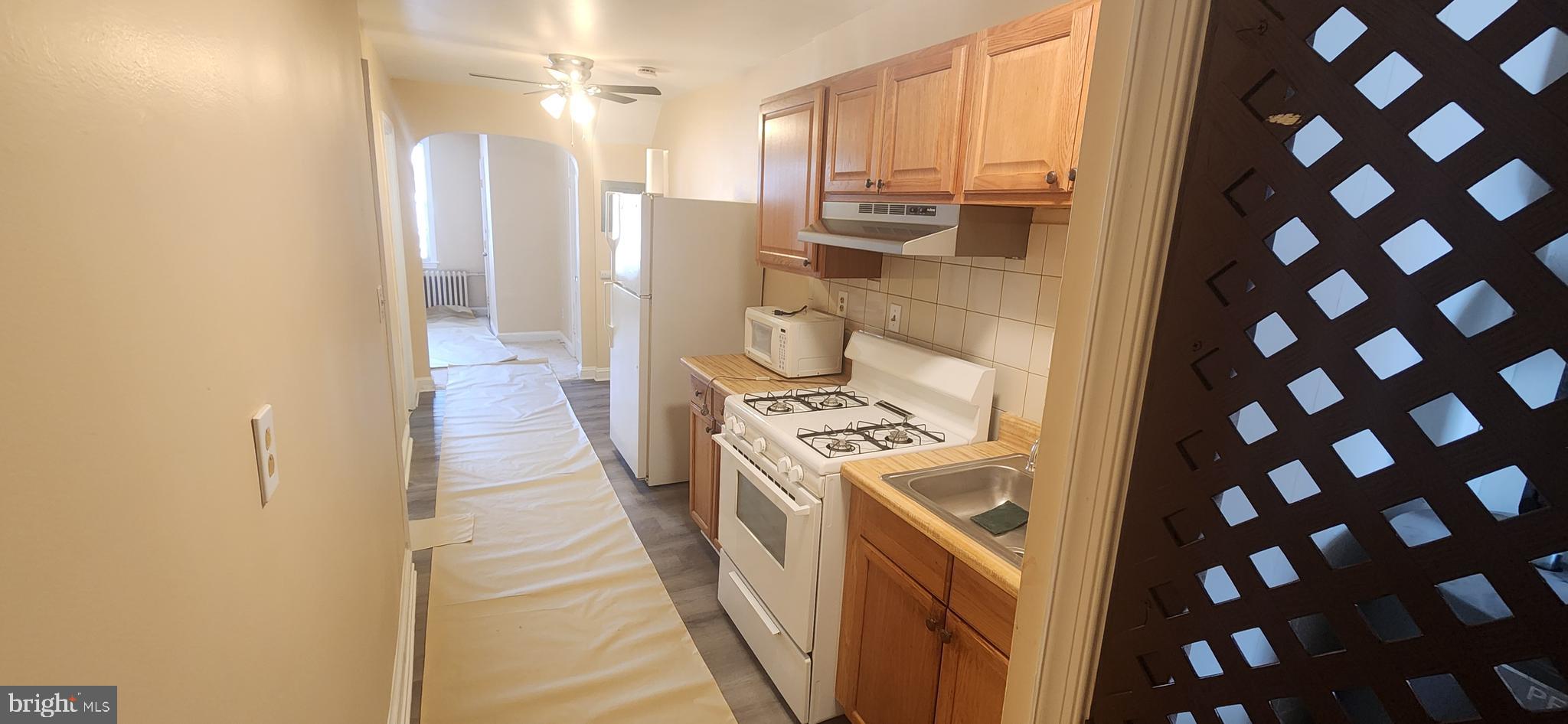 2017 I Street Northeast, Unit 4 Washington, DC 20002 - Photo 13 of 27 a kitchen with a refrigerator a stove and a sink
