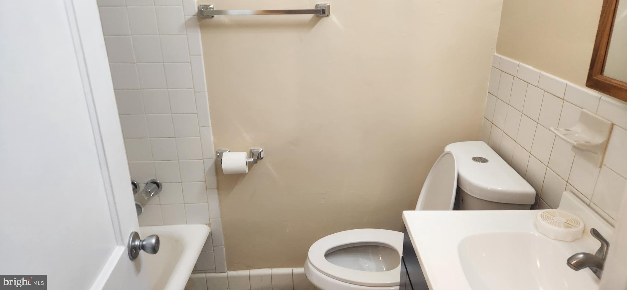 2017 I Street Northeast, Unit 4 Washington, DC 20002 - Photo 4 of 27 a white toilet sitting next to a shower