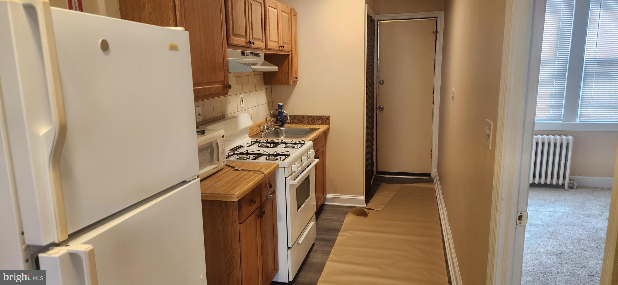 2017 I Street Northeast, Unit 4 Washington, DC 20002 - Photo 6 of 27 a view of a kitchen from the hallway