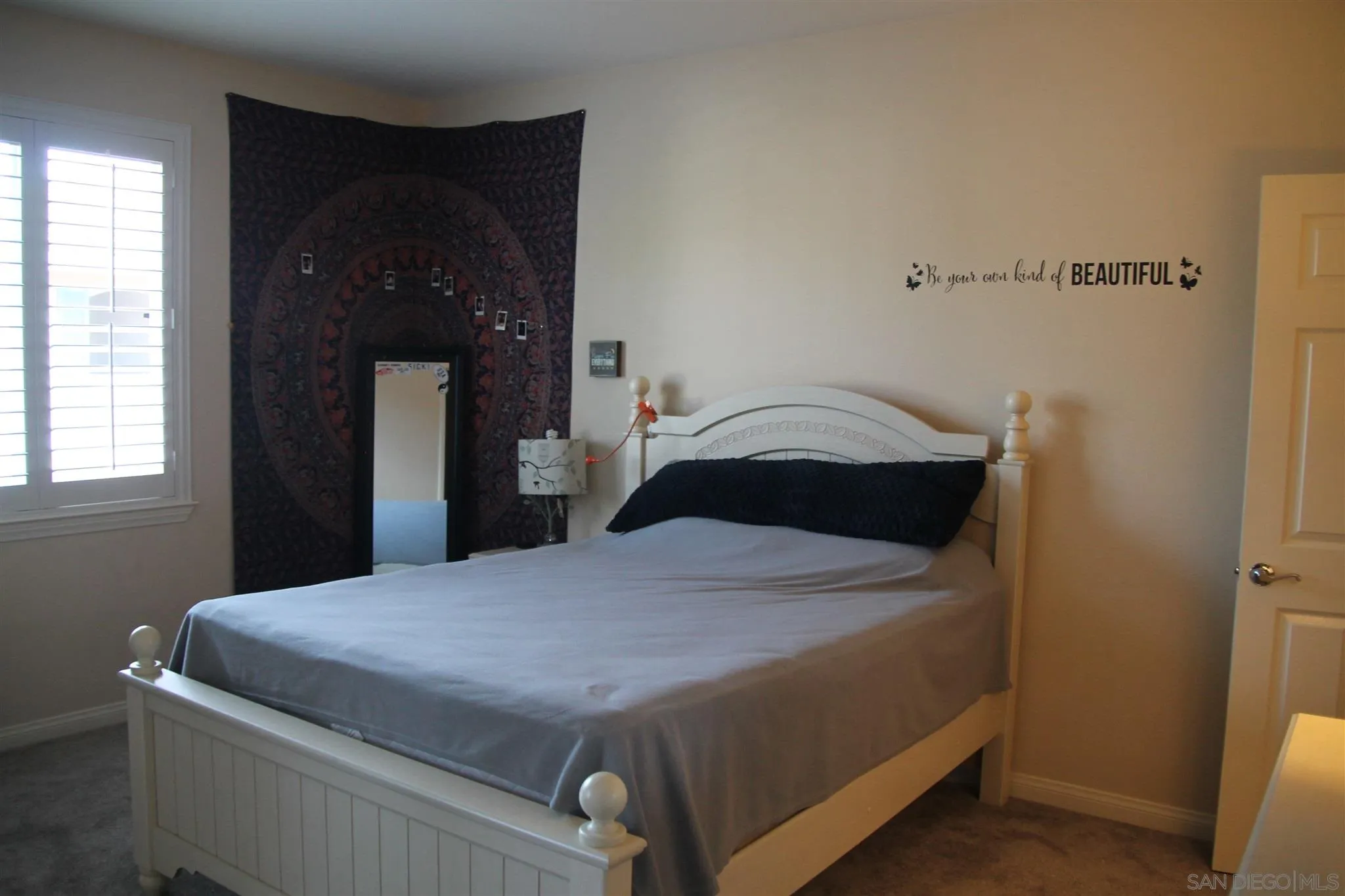 13039 Evening Creek Drive South, Unit 36 San Diego, CA 92128 - Photo 17 of 31 a bedroom with a bed and window