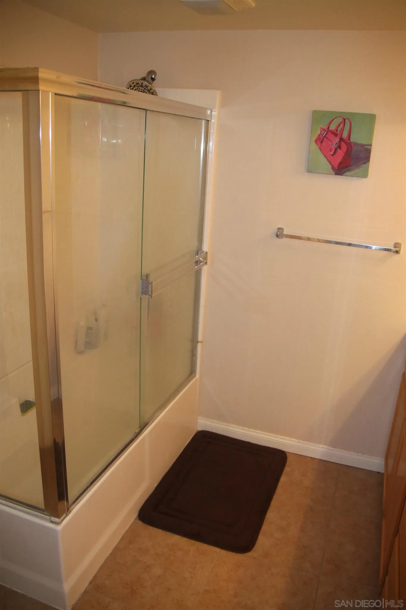 13039 Evening Creek Drive South, Unit 36 San Diego, CA 92128 - Photo 20 of 31 a bathroom with a shower and a sink