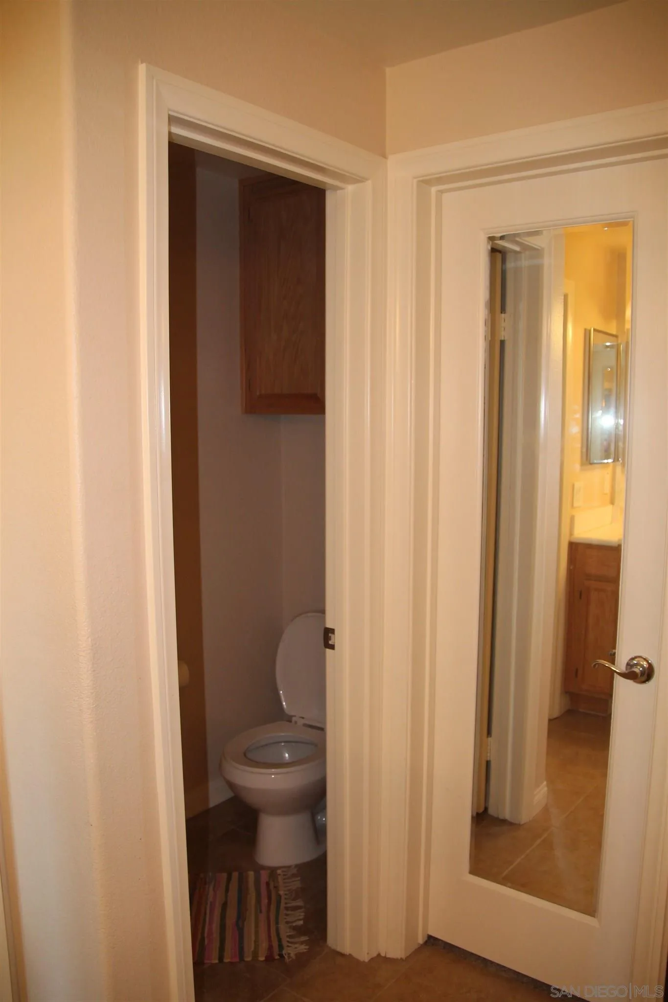 13039 Evening Creek Drive South, Unit 36 San Diego, CA 92128 - Photo 21 of 31 a bathroom with a toilet and a sink