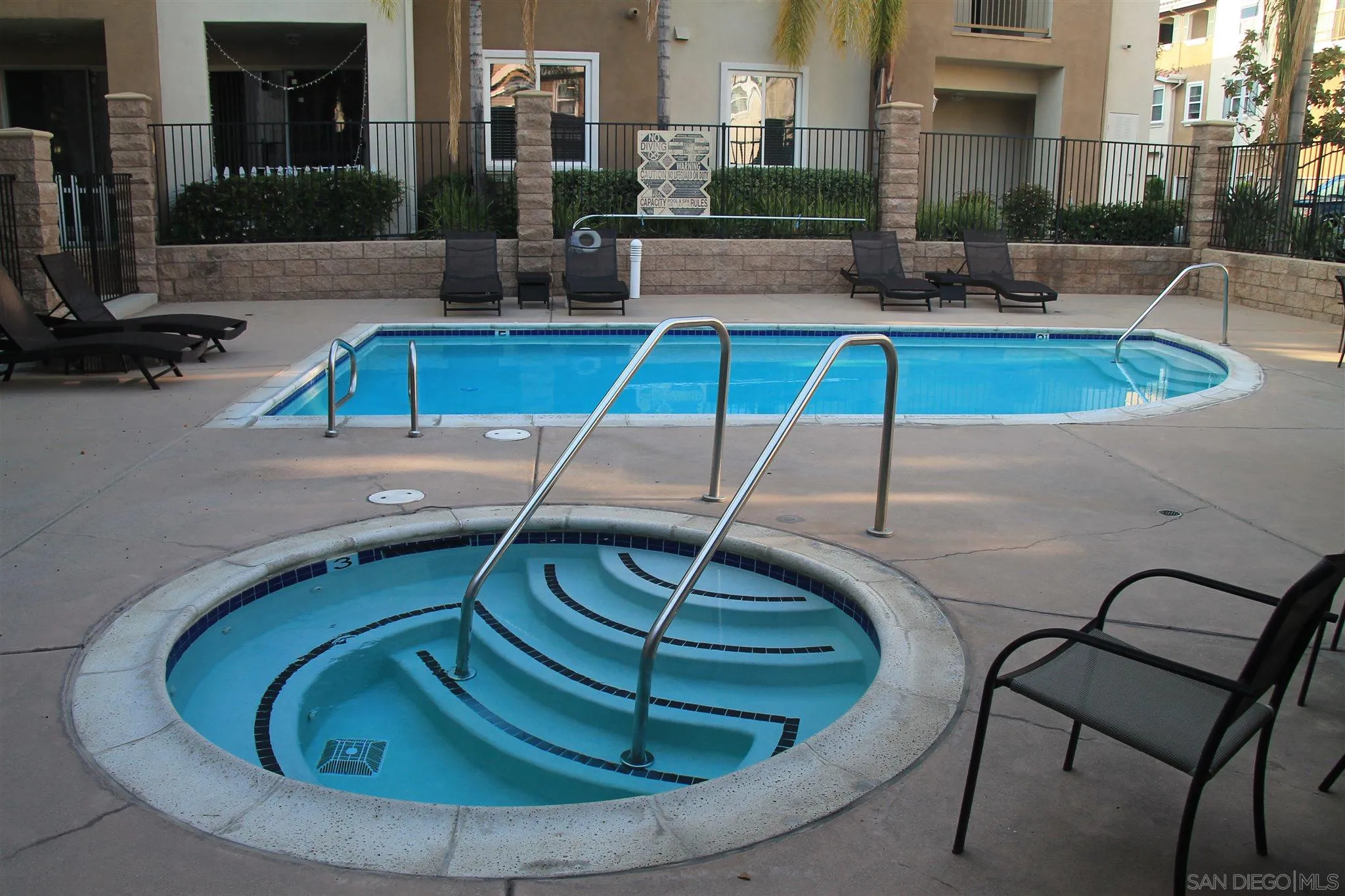 13039 Evening Creek Drive South, Unit 36 San Diego, CA 92128 - Photo 28 of 31 a view of swimming pool with outdoor seating