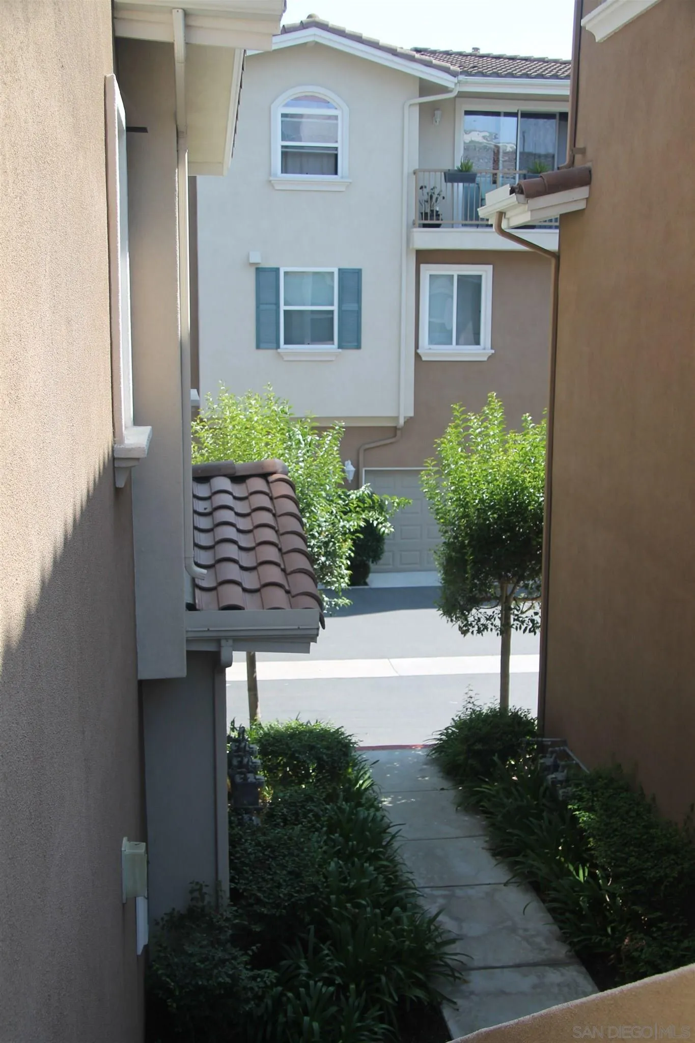 13039 Evening Creek Drive South, Unit 36 San Diego, CA 92128 - Photo 31 of 31 a view of a house with a yard