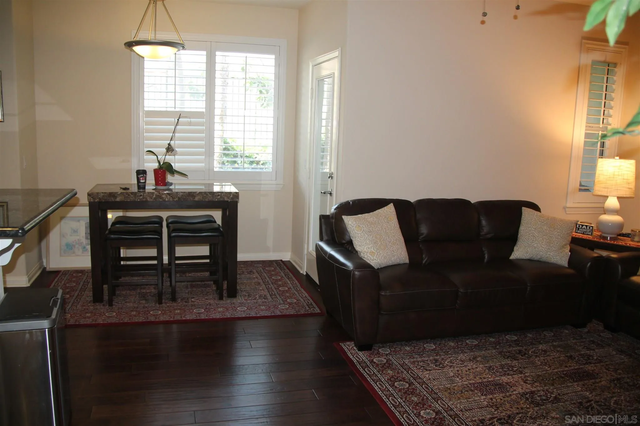 13039 Evening Creek Drive South, Unit 36 San Diego, CA 92128 - Photo 9 of 31 a living room with furniture and a window