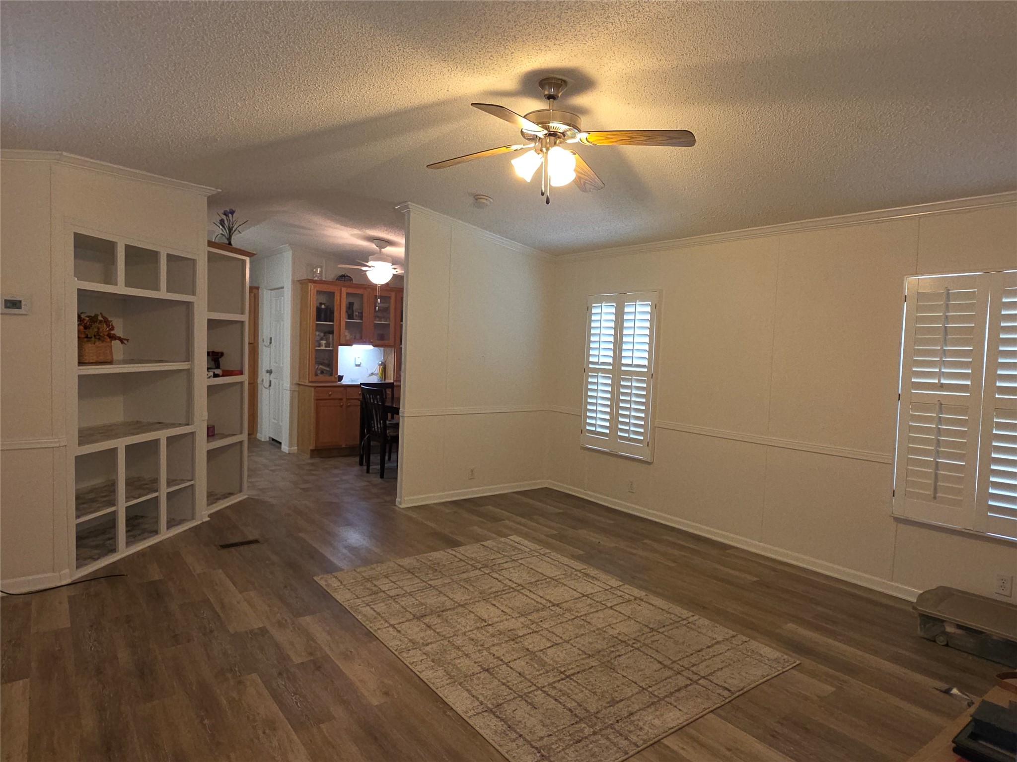 70 Montego Way Point Blank, TX 77364 - Photo 5 of 41 a view of an empty room with a window and wooden floor