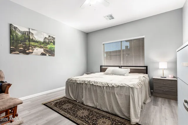 a bedroom with a bed and a window