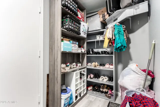 a store room with lots of different colored cloths