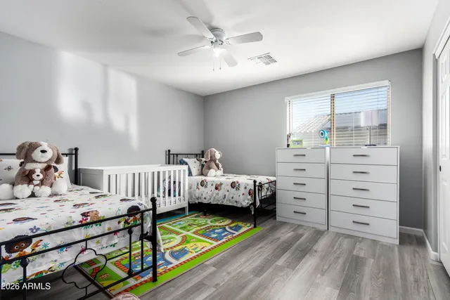 a bedroom with a bed and a dresser