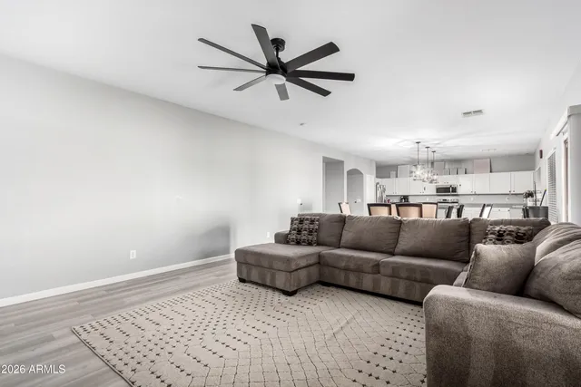 a living room with furniture and a rug