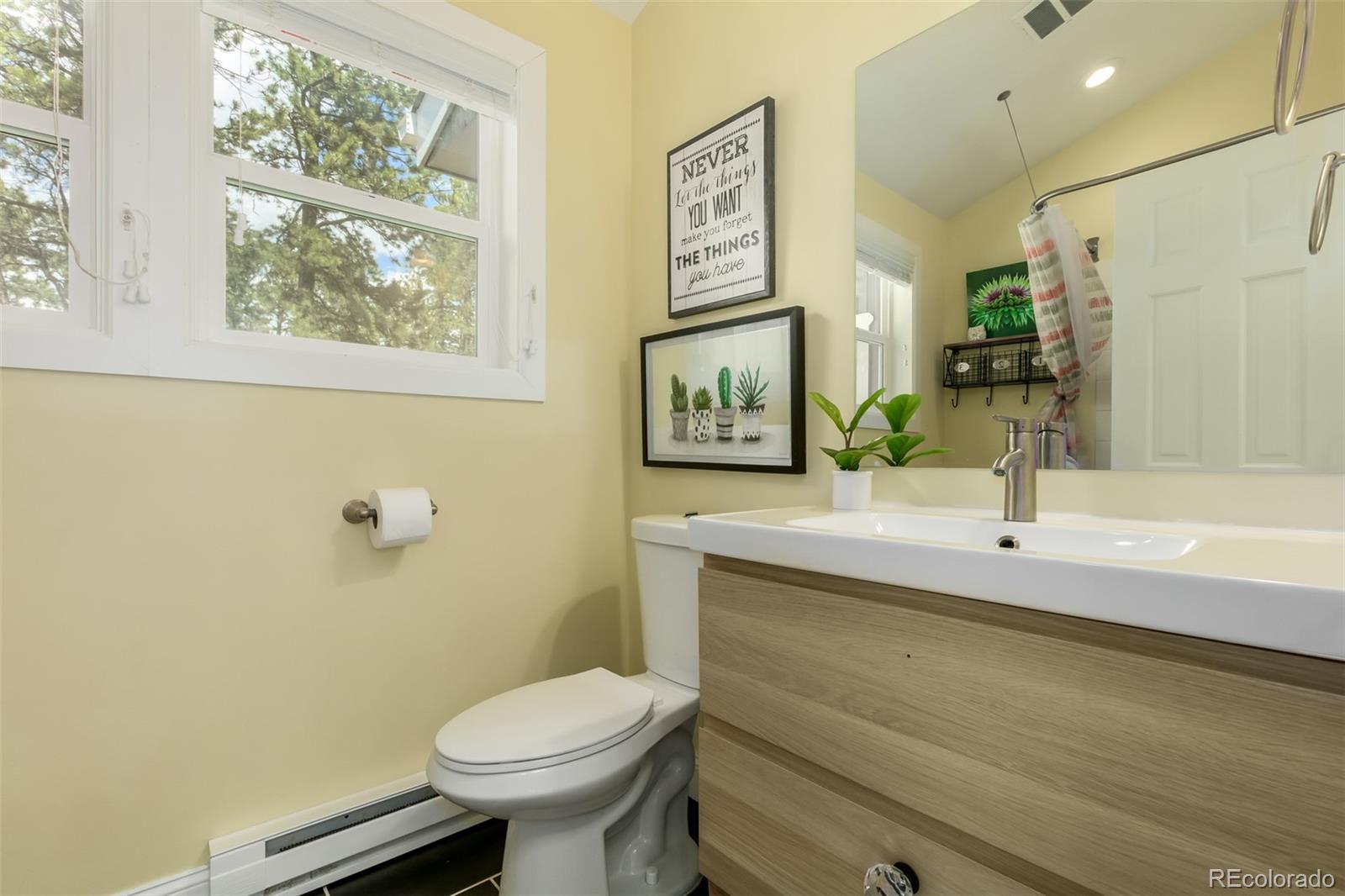 95 Double Tree Road Bailey, CO 80421 - Photo 13 of 40 a bathroom with a sink and a toilet