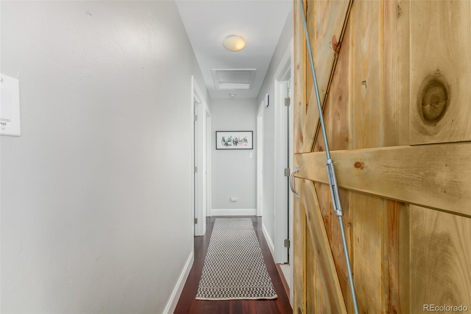 95 Double Tree Road Bailey, CO 80421 - Photo 15 of 40 a view of a hallway with wooden floor and entryway