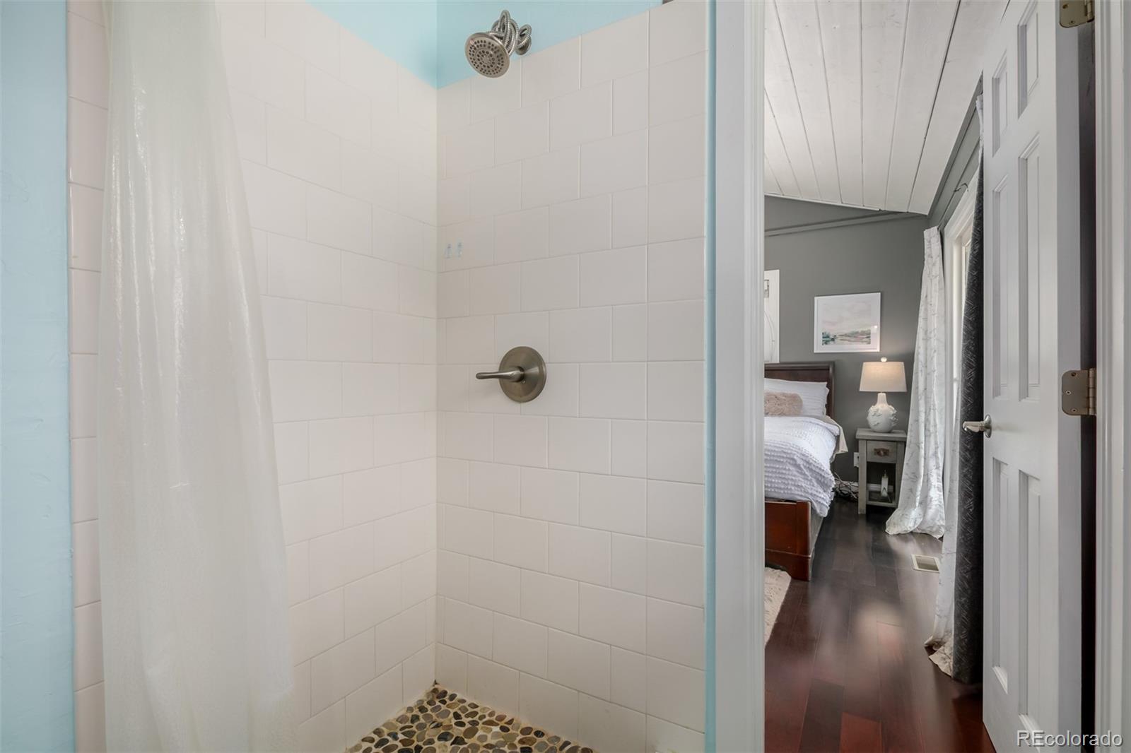 95 Double Tree Road Bailey, CO 80421 - Photo 19 of 40 a view of a bathroom from a hallway
