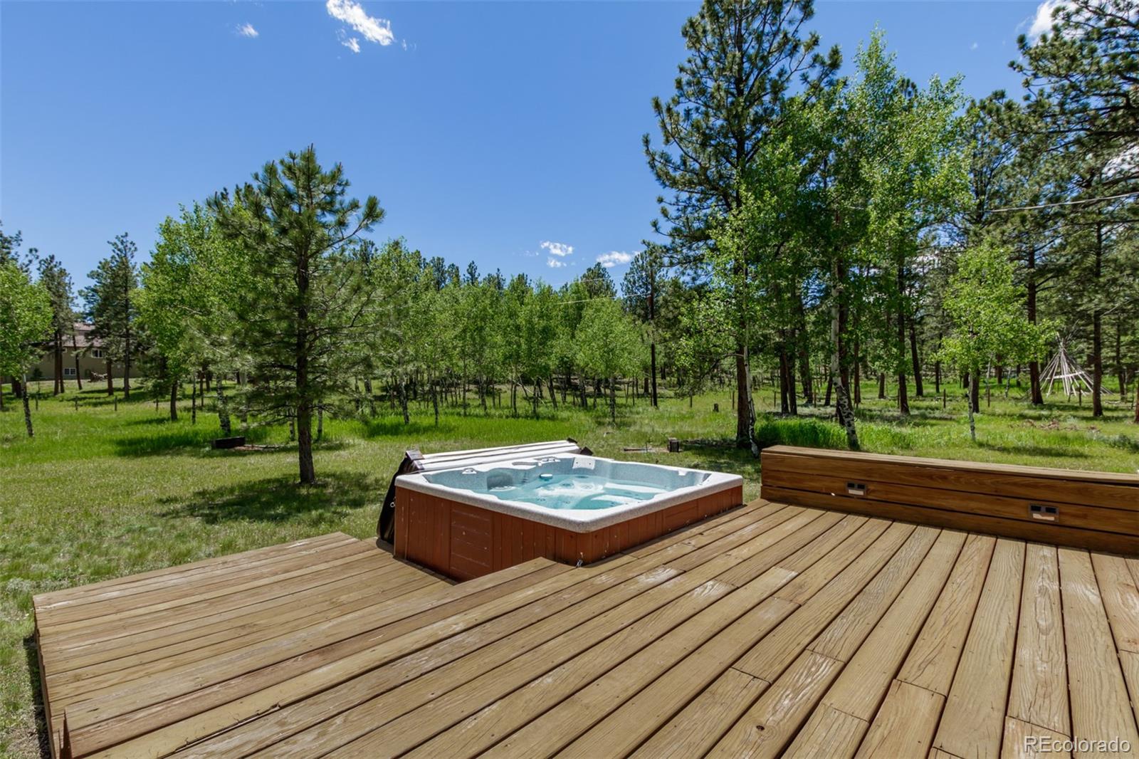 95 Double Tree Road Bailey, CO 80421 - Photo 24 of 40 a view of a wooden floor with a bench