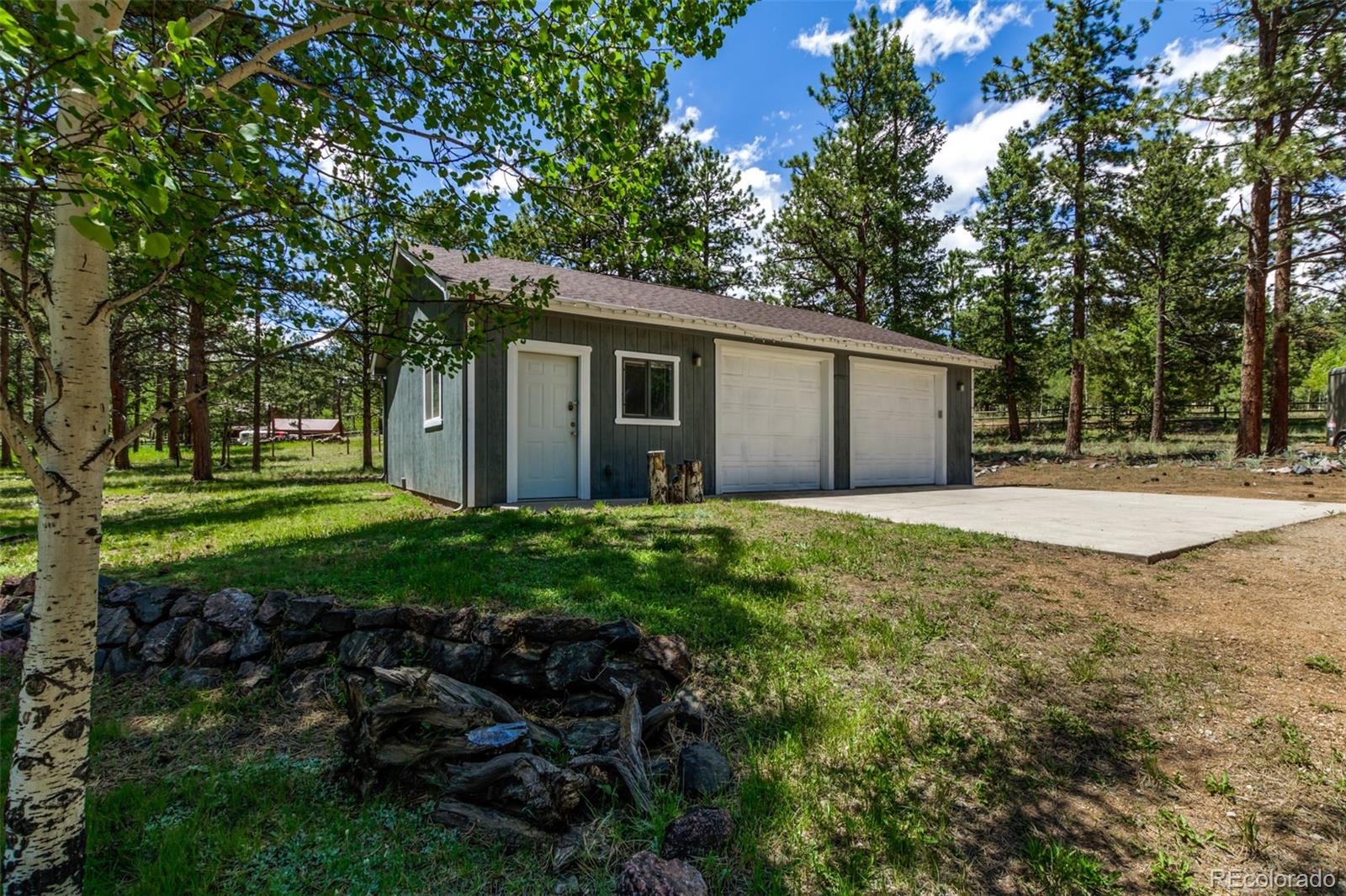 95 Double Tree Road Bailey, CO 80421 - Photo 26 of 40 a house view with a garden space