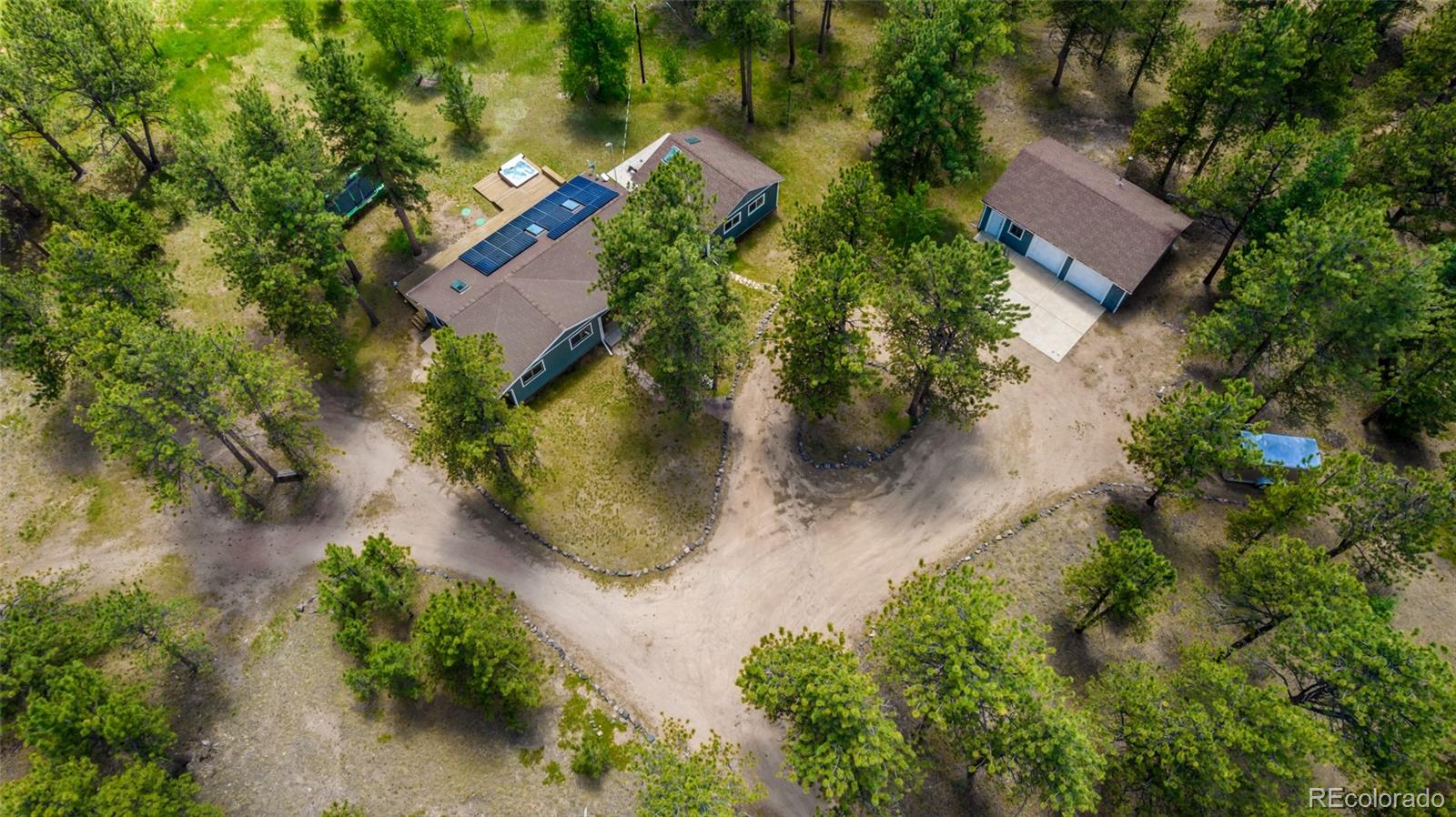 95 Double Tree Road Bailey, CO 80421 - Photo 39 of 40 an aerial view of a house with a yard and garden