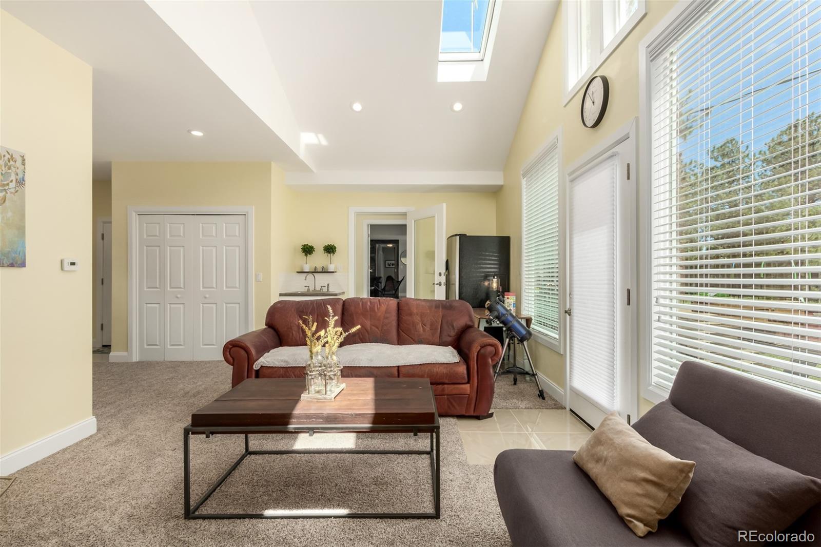 95 Double Tree Road Bailey, CO 80421 - Photo 10 of 40 a living room with furniture and a large window