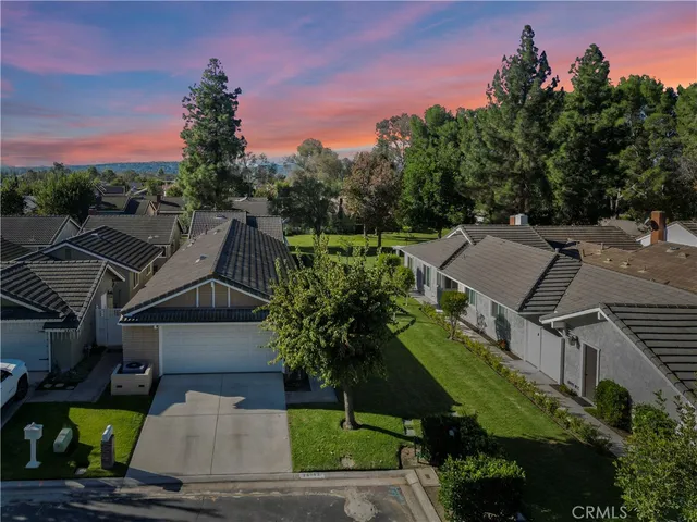 an aerial view of houses with yard