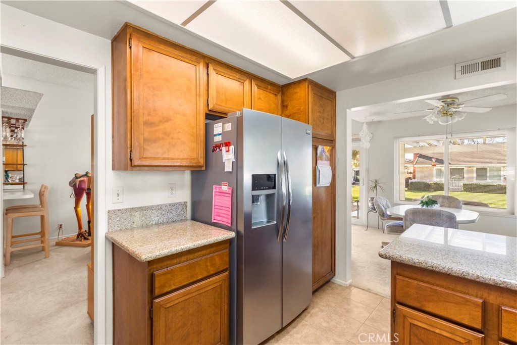 24142 Minnetonka Lane Lake Forest, CA 92630 - Photo 13 of 30 a kitchen with stainless steel appliances granite countertop a refrigerator and a sink