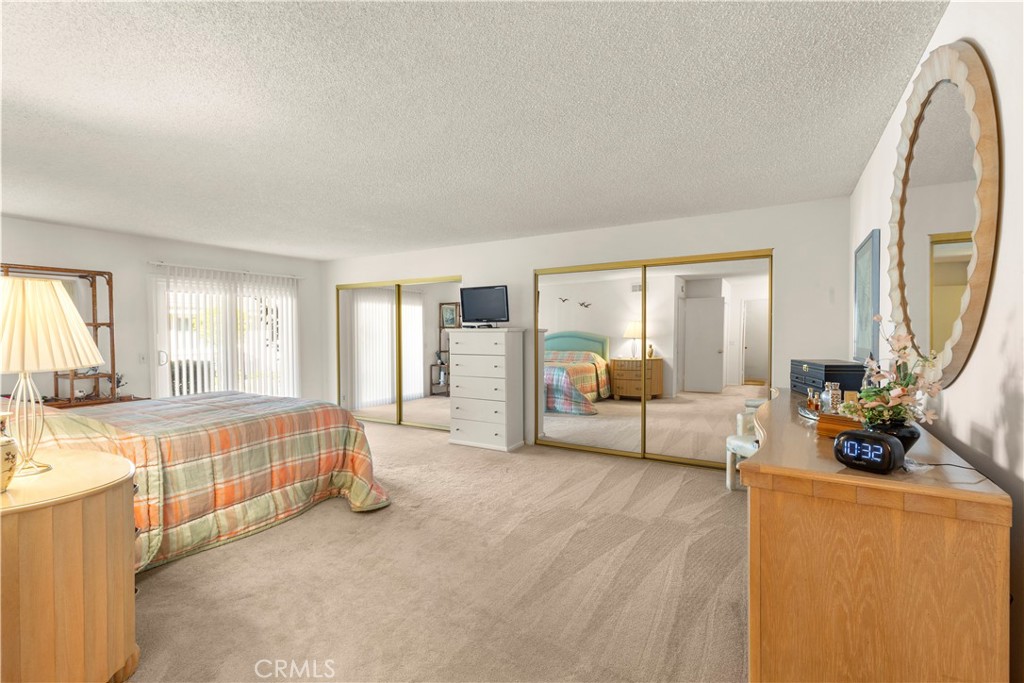 24142 Minnetonka Lane Lake Forest, CA 92630 - Photo 17 of 30 a spacious bedroom with a large bed and a large window