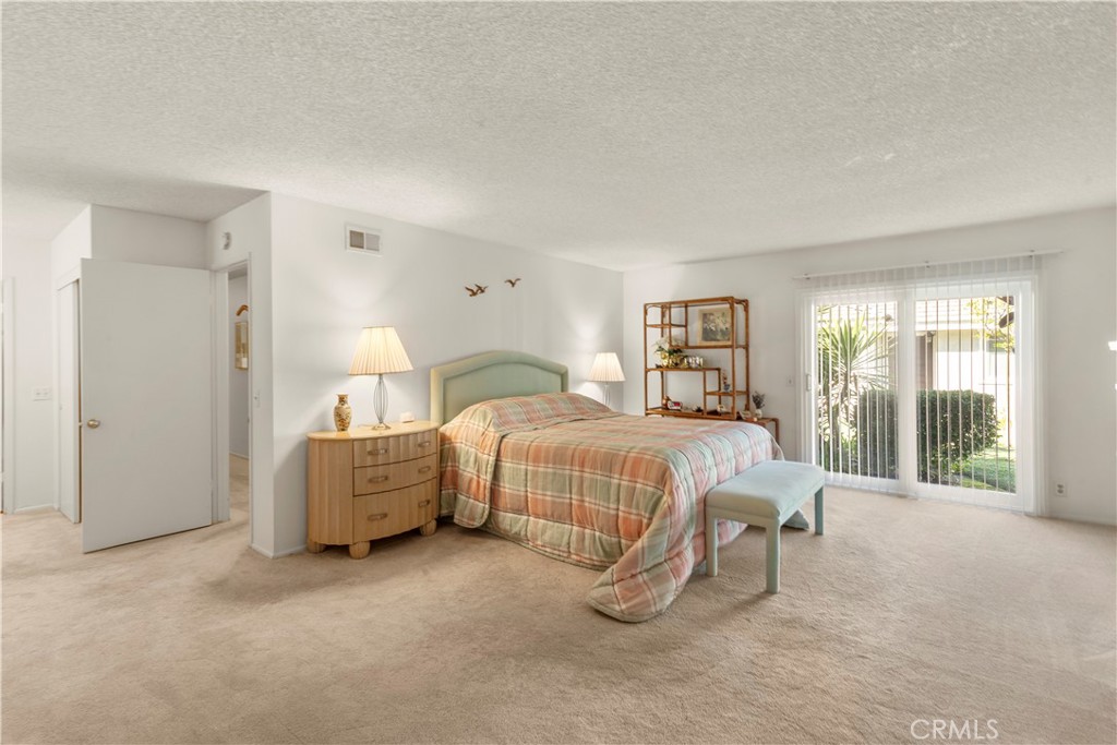 24142 Minnetonka Lane Lake Forest, CA 92630 - Photo 18 of 30 a bedroom with a bed and large window