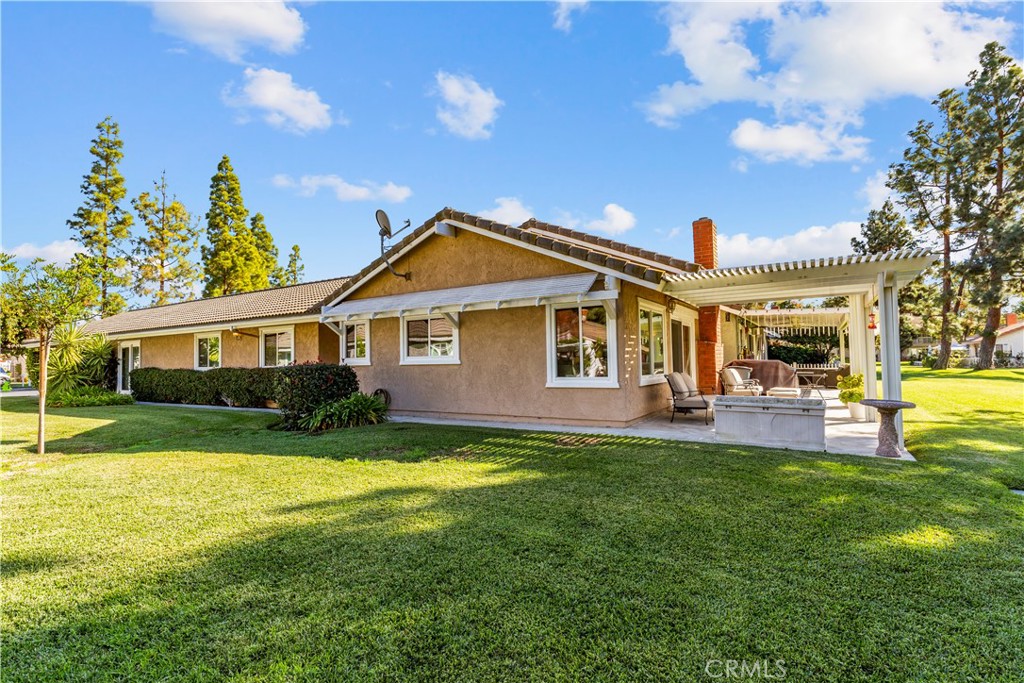24142 Minnetonka Lane Lake Forest, CA 92630 - Photo 4 of 30 a front view of a house with a yard porch and outdoor seating