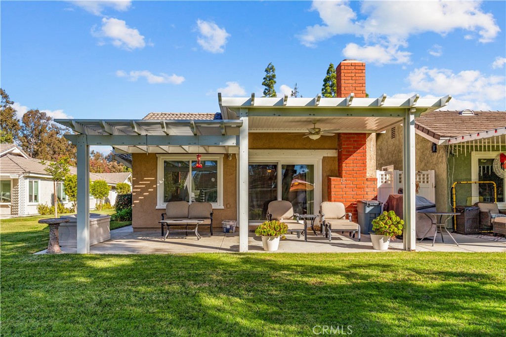 24142 Minnetonka Lane Lake Forest, CA 92630 - Photo 5 of 30 a view of a house with a big yard and potted plants