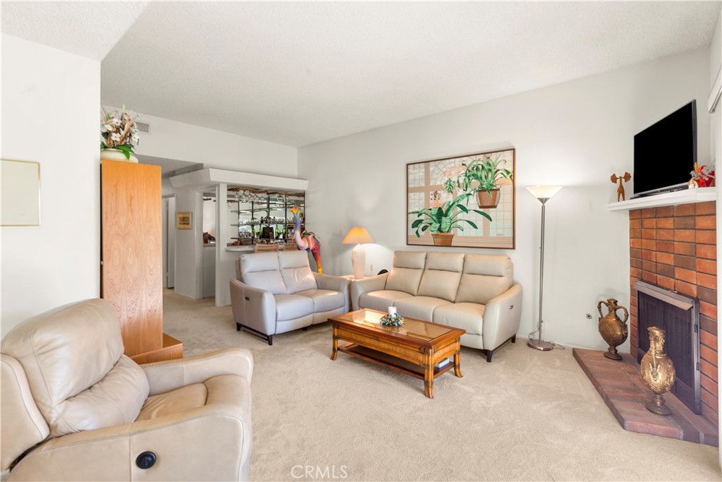 24142 Minnetonka Lane Lake Forest, CA 92630 - Photo 6 of 30 a living room with furniture and a flat screen tv