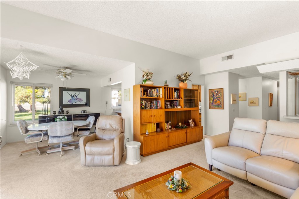 24142 Minnetonka Lane Lake Forest, CA 92630 - Photo 7 of 30 a living room with furniture fireplace and a window