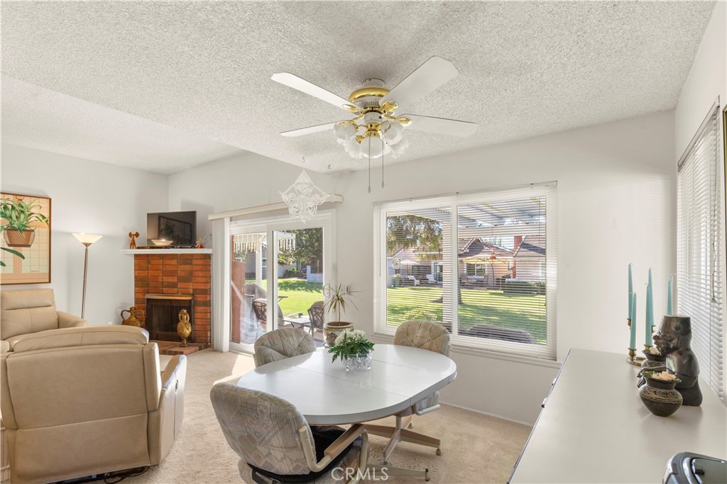 24142 Minnetonka Lane Lake Forest, CA 92630 - Photo 8 of 30 a living room with fireplace furniture and a flat screen tv
