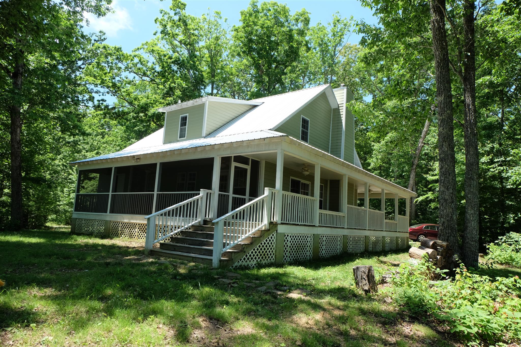Rear elevation shows screened back porch.