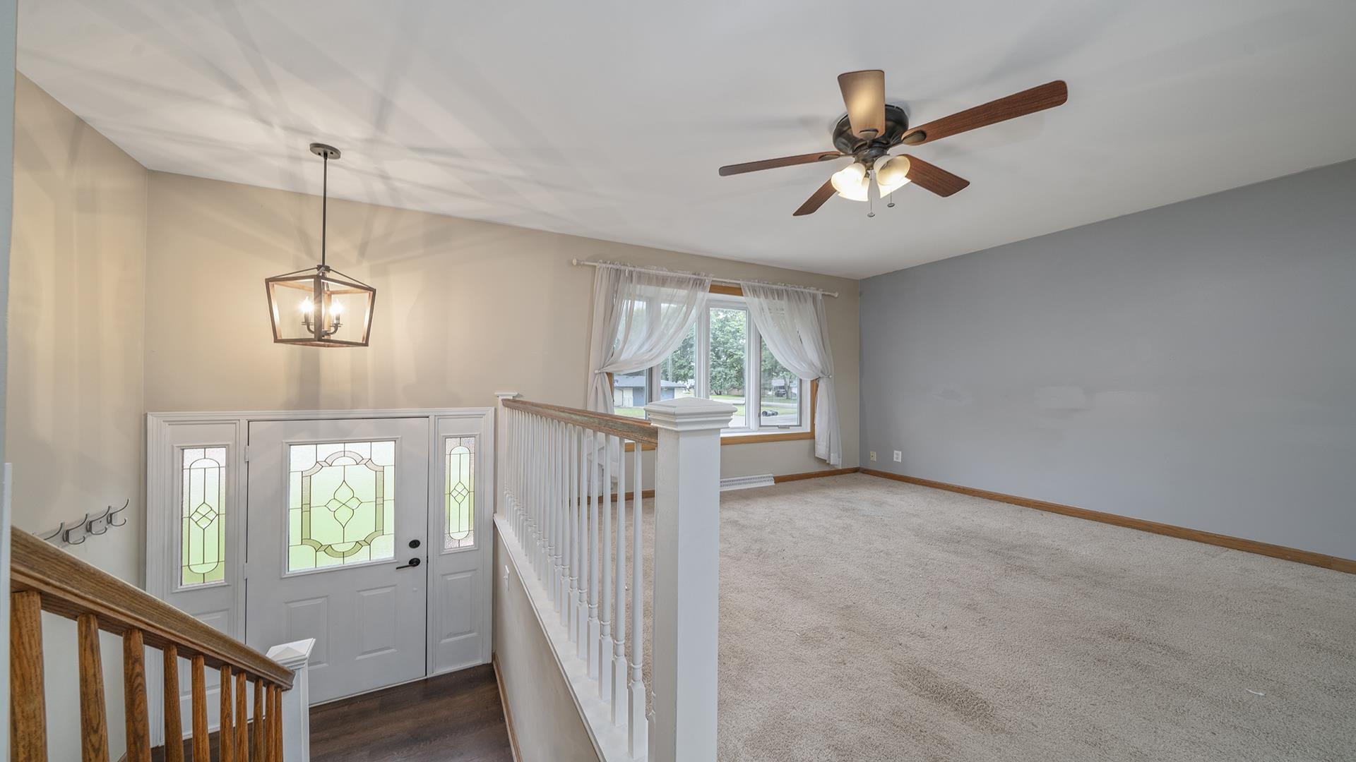 445 Rebecca Road Belvidere, IL 61008 - Photo 12 of 34 a view of an empty room with wooden floor and a window