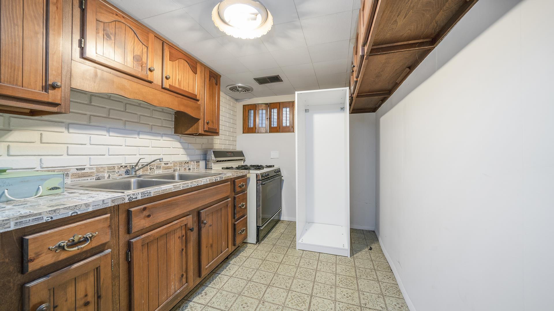 445 Rebecca Road Belvidere, IL 61008 - Photo 22 of 34 a kitchen with granite countertop a sink and cabinets