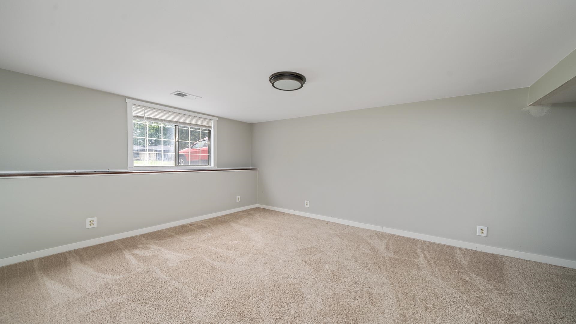 445 Rebecca Road Belvidere, IL 61008 - Photo 23 of 34 a view of an empty room with a window