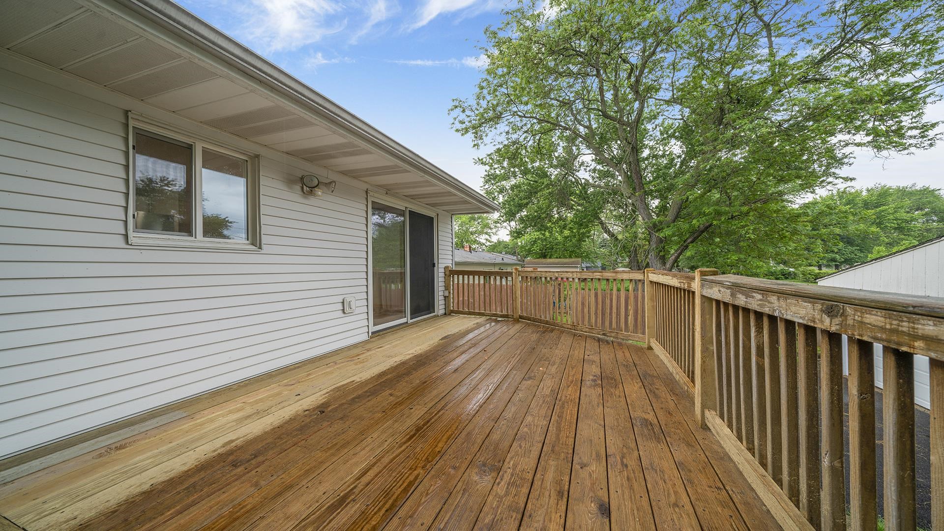 445 Rebecca Road Belvidere, IL 61008 - Photo 27 of 34 a view of deck with wooden floor and fence