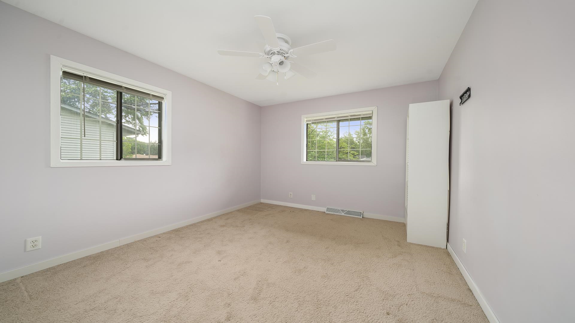 445 Rebecca Road Belvidere, IL 61008 - Photo 3 of 34 an empty room with windows and closet