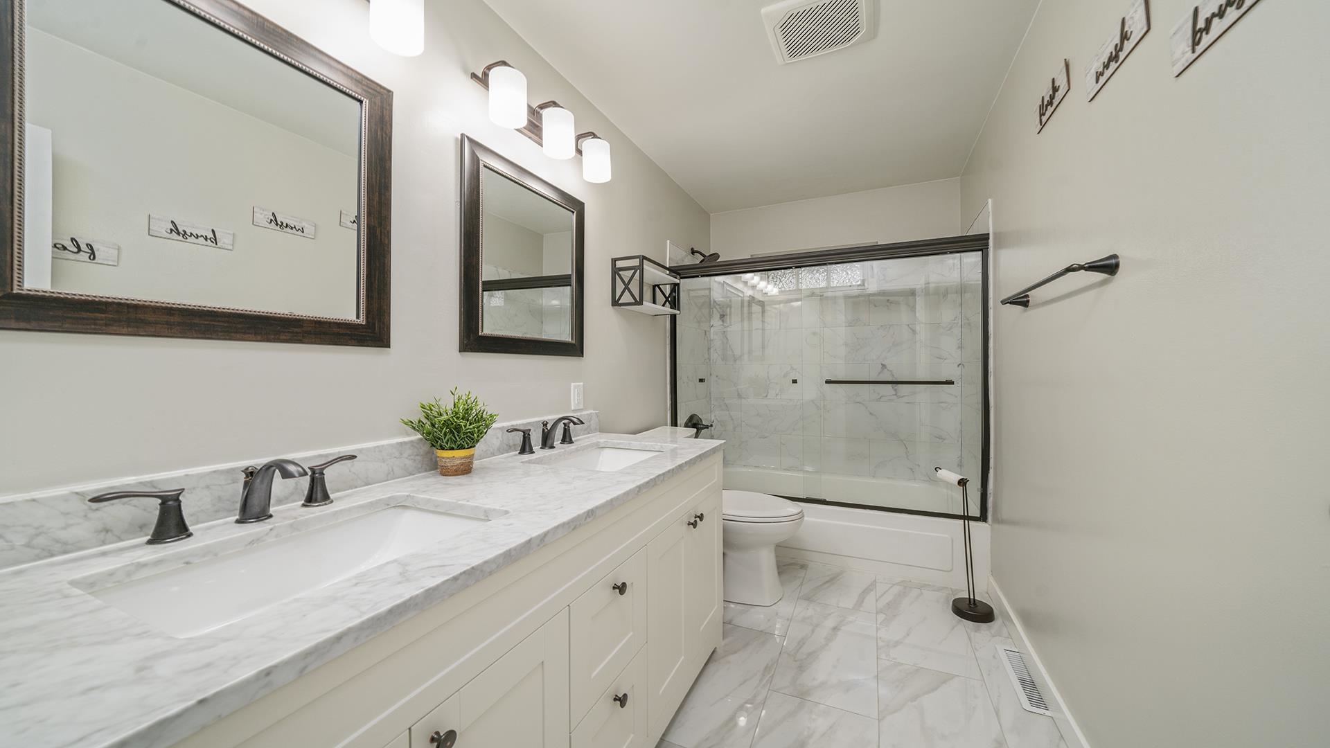 445 Rebecca Road Belvidere, IL 61008 - Photo 9 of 34 a bathroom with a granite countertop sink mirror vanity and toilet
