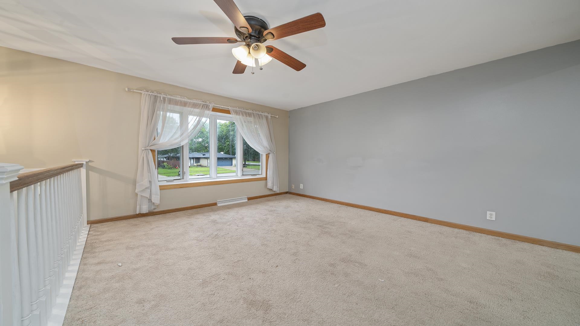 445 Rebecca Road Belvidere, IL 61008 - Photo 10 of 34 an empty room with windows and ceiling fan