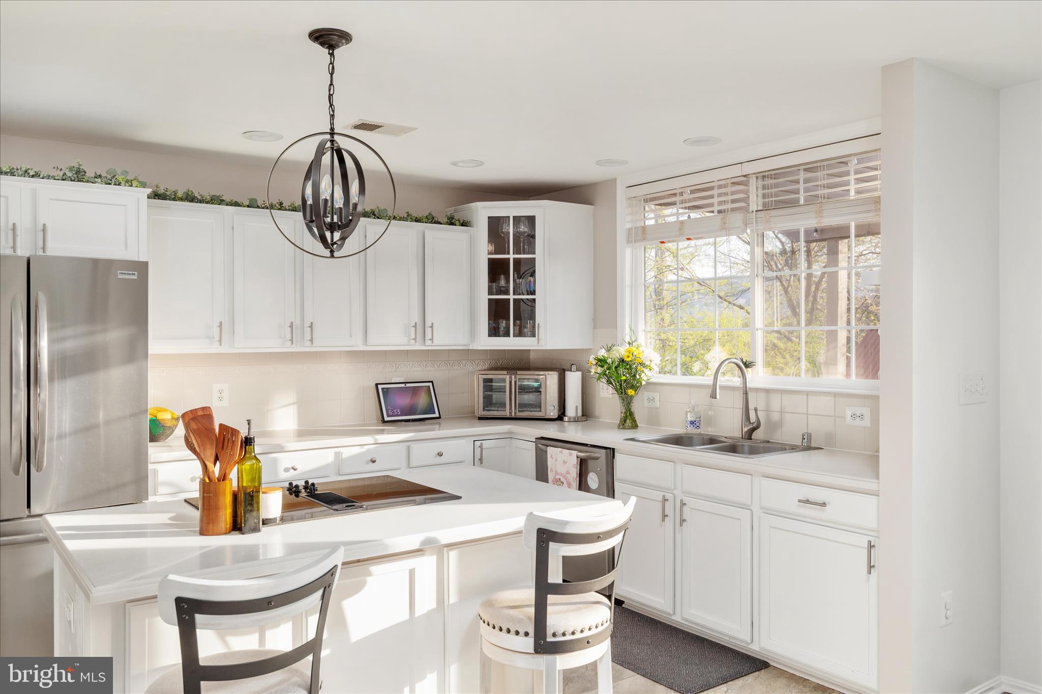 1161 Happy Ridge Drive Front Royal, VA 22630 - Photo 12 of 49 a kitchen with a table chairs and white cabinets