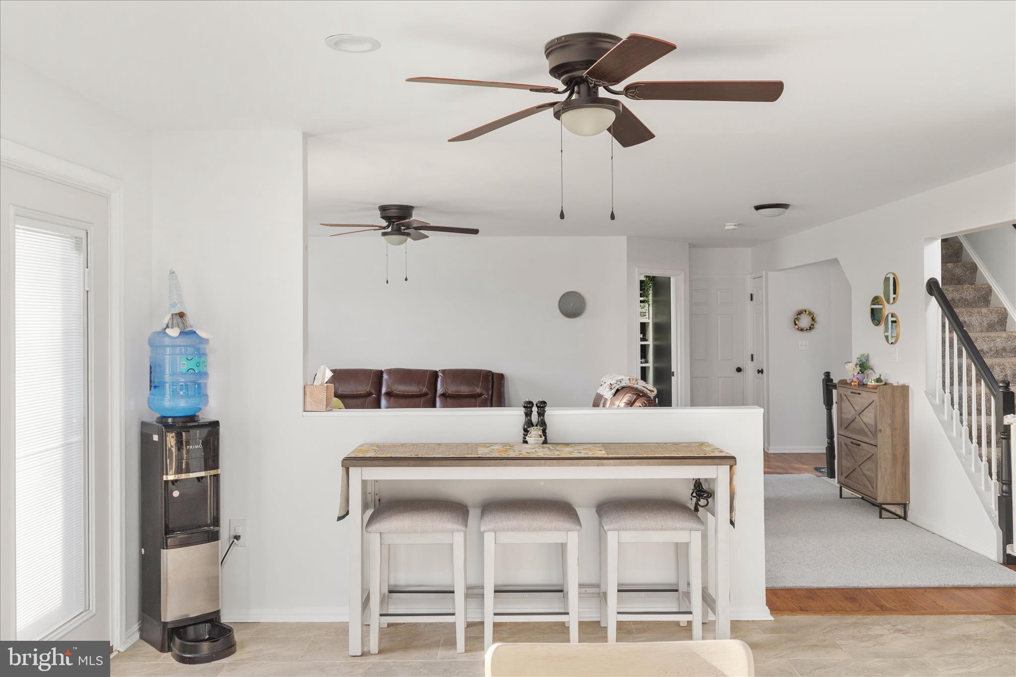 1161 Happy Ridge Drive Front Royal, VA 22630 - Photo 15 of 49 a kitchen with a dining table and chairs