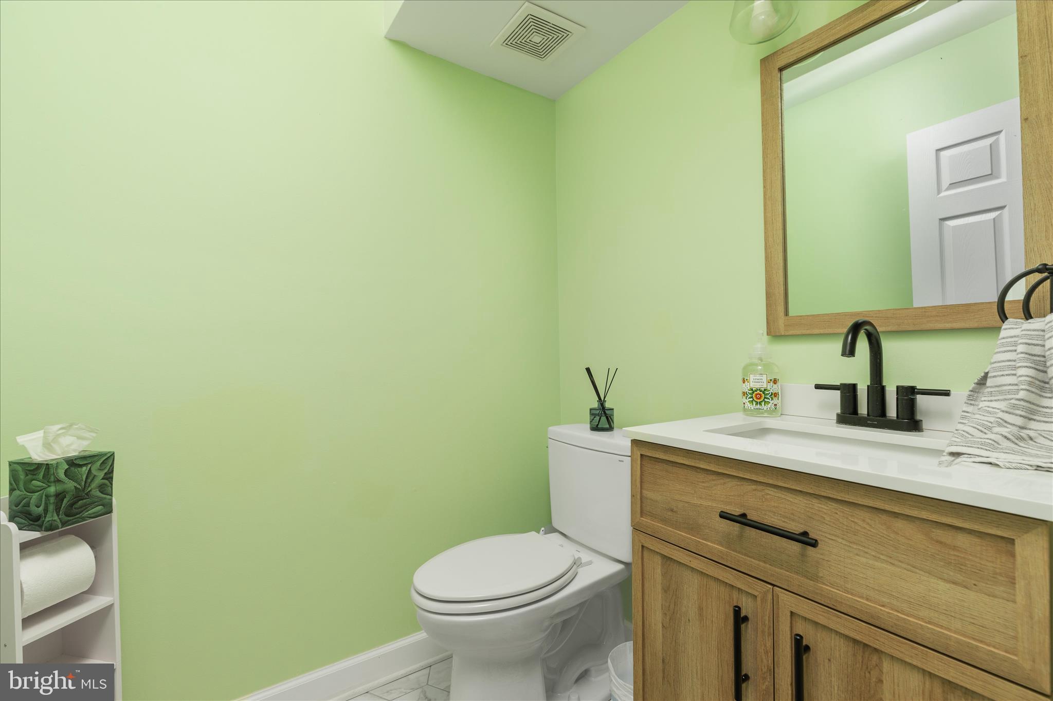 1161 Happy Ridge Drive Front Royal, VA 22630 - Photo 17 of 49 a bathroom with a granite countertop toilet and a sink