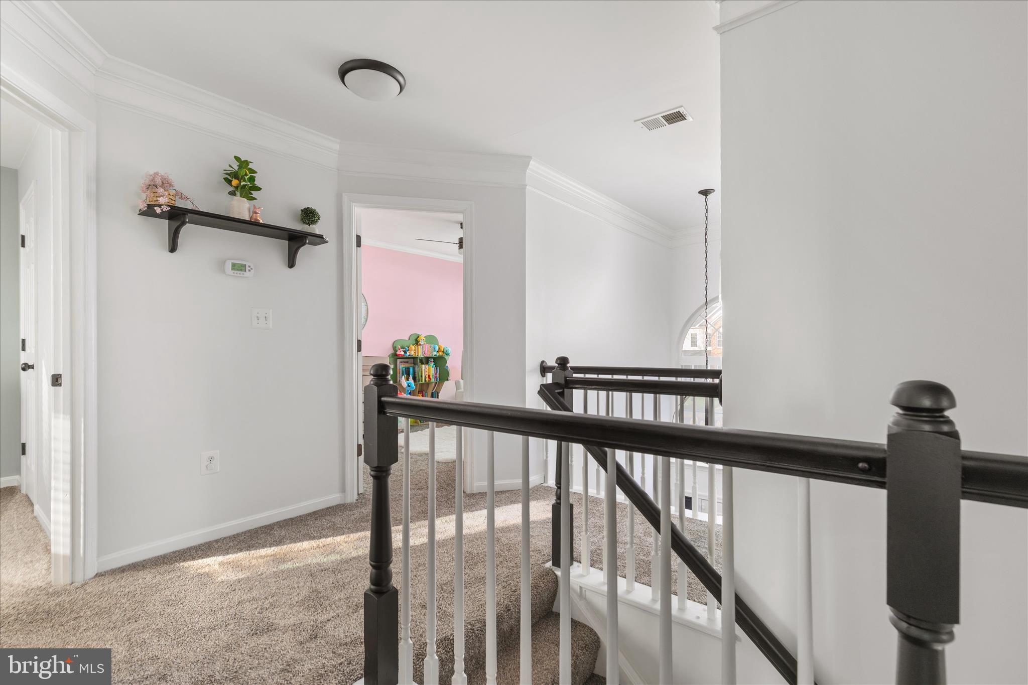 1161 Happy Ridge Drive Front Royal, VA 22630 - Photo 19 of 49 a view of a hallway with wooden floor and staircase