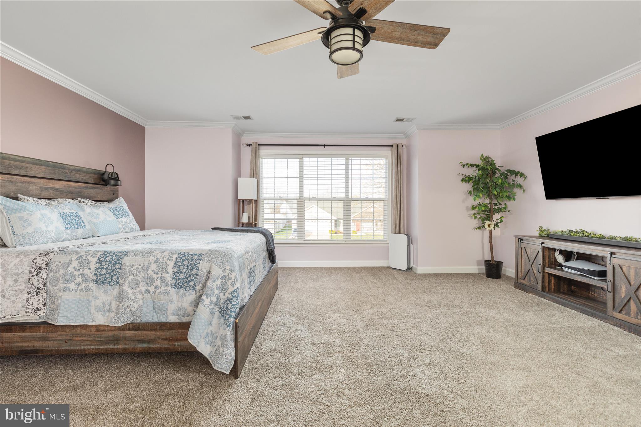 1161 Happy Ridge Drive Front Royal, VA 22630 - Photo 21 of 49 a spacious bedroom with a bed and a television